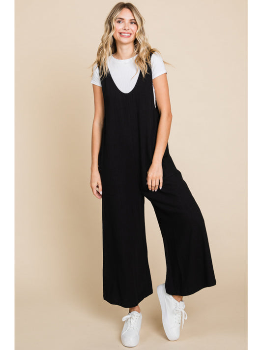 Solid linen sleeveless jumpsuit, side pockets, and wide crop legs
