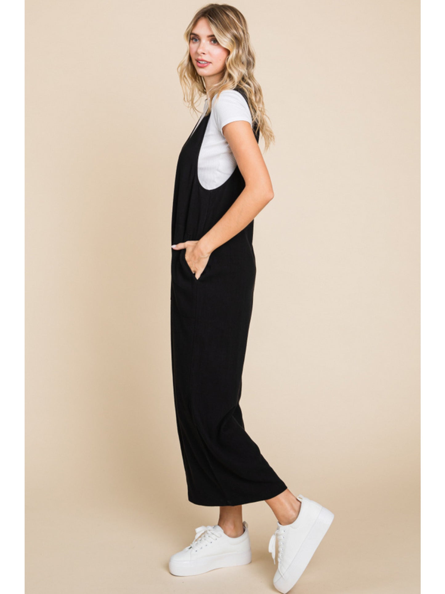 Solid linen sleeveless jumpsuit, side pockets, and wide crop legs